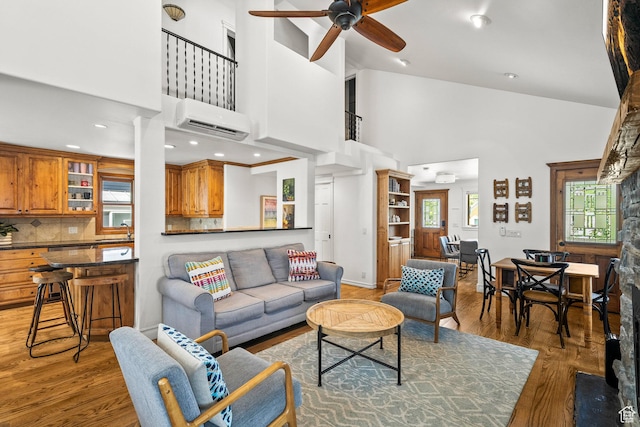 915 Norfolk Ave, Park City, UT 84060 - living room with a wall mounted AC, high vaulted ceiling, a ceiling fan, light wood-type flooring, and recessed lighting