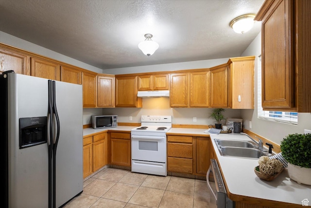 10 S 1000 E, Payson, UT 84651 - kitchen featuring stainless steel appliances, under cabinet range hood, light countertops, and brown cabinetry