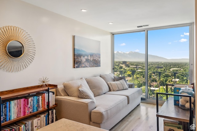 777 E S Temple Unit 13B, Salt Lake City, UT 84102 - living room featuring a wall of windows, light wood-style floors, and a mountain view