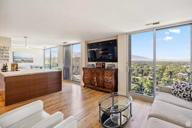 777 E S Temple Unit 13B, Salt Lake City, UT 84102 - living room with expansive windows and light wood-style flooring