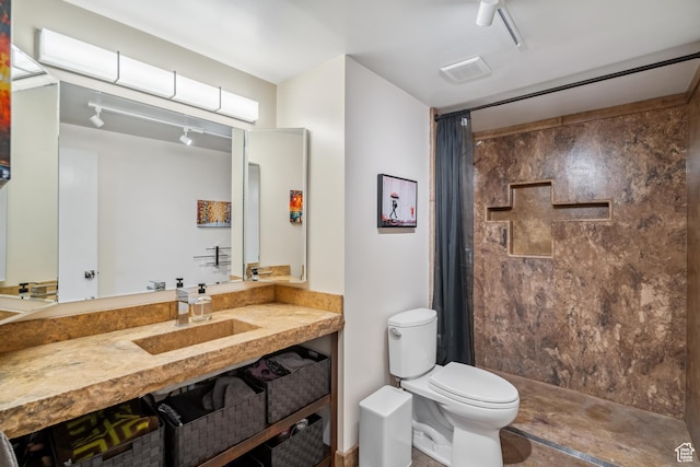 777 E S Temple Unit 13B, Salt Lake City, UT 84102 - bathroom featuring a shower with curtain and vanity