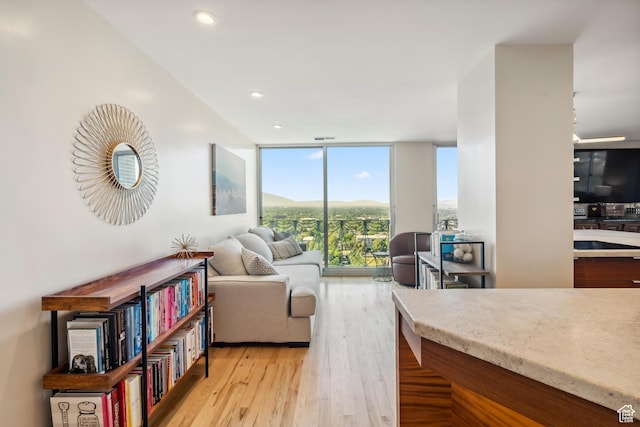 777 E S Temple Unit 13B, Salt Lake City, UT 84102 - living room with expansive windows, light wood-style floors, and recessed lighting