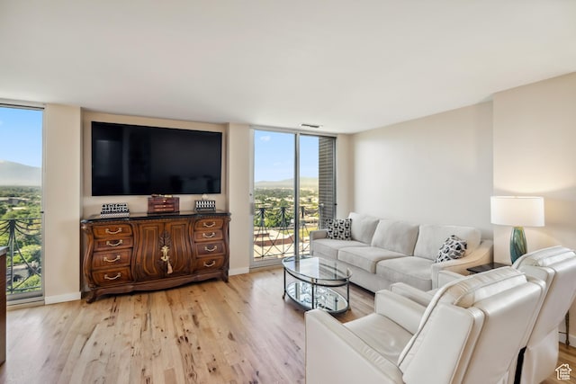 777 E S Temple Unit 13B, Salt Lake City, UT 84102 - living area with expansive windows and light wood-type flooring