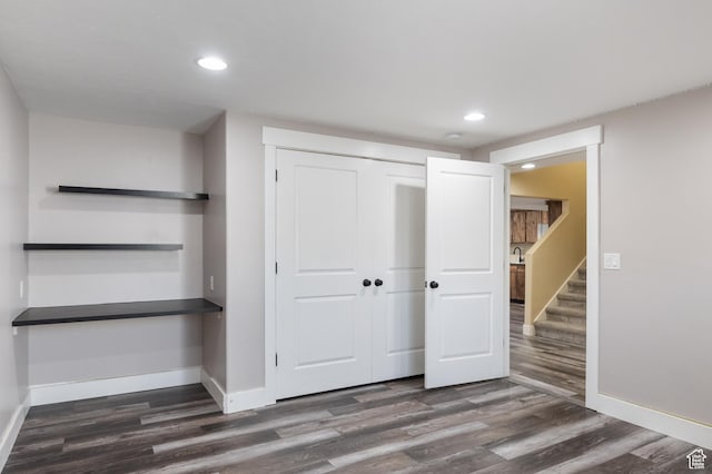 5194 Hedgerose Dr, Herriman, UT 84096 - unfurnished bedroom featuring dark wood-style floors, recessed lighting, and a closet