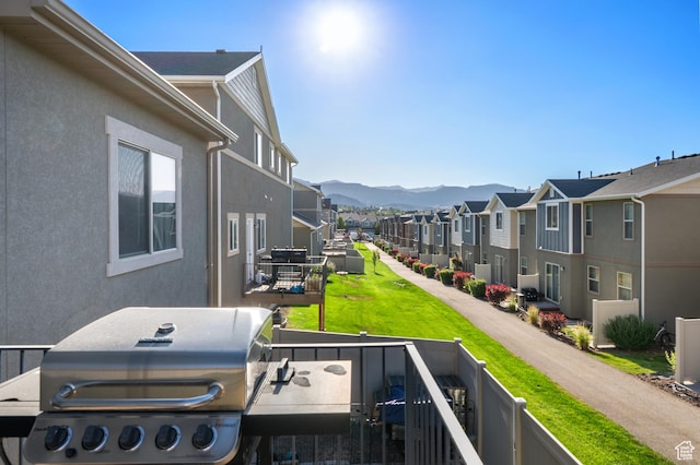 5194 Hedgerose Dr, Herriman, UT 84096 - exterior space with grilling area, a residential view, and a mountain view