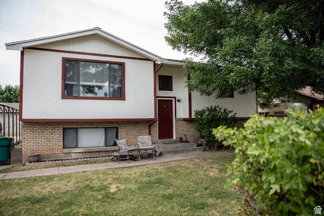 729 W 2300 N, Harrisville, UT 84414 - back of property with brick siding and a lawn