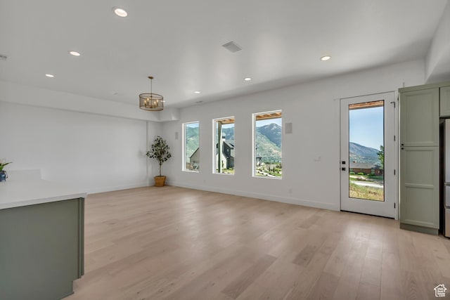 481 E 3675 N, North Ogden, UT 84414 - spare room featuring a chandelier, recessed lighting, and light wood-type flooring