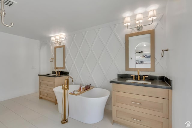 481 E 3675 N, North Ogden, UT 84414 - bathroom featuring two vanities, a soaking tub, a decorative wall, and tile patterned flooring