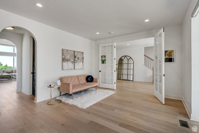 481 E 3675 N, North Ogden, UT 84414 - entryway with french doors, light wood-style flooring, recessed lighting, arched walkways, and stairs