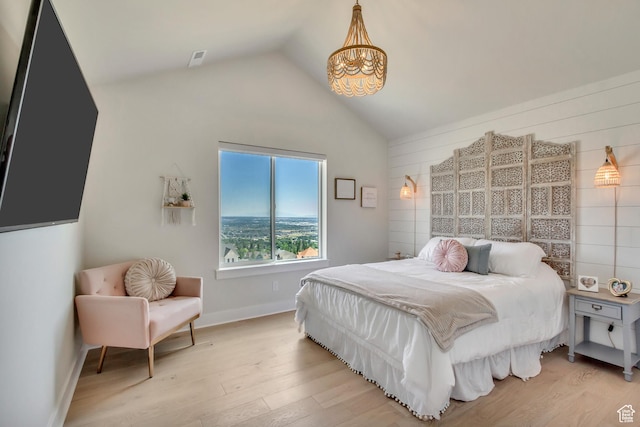 481 E 3675 N, North Ogden, UT 84414 - bedroom featuring a chandelier, lofted ceiling, and light wood finished floors