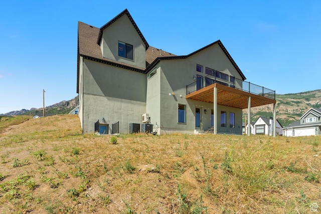 481 E 3675 N, North Ogden, UT 84414 - back of house featuring stucco siding and a deck with mountain view