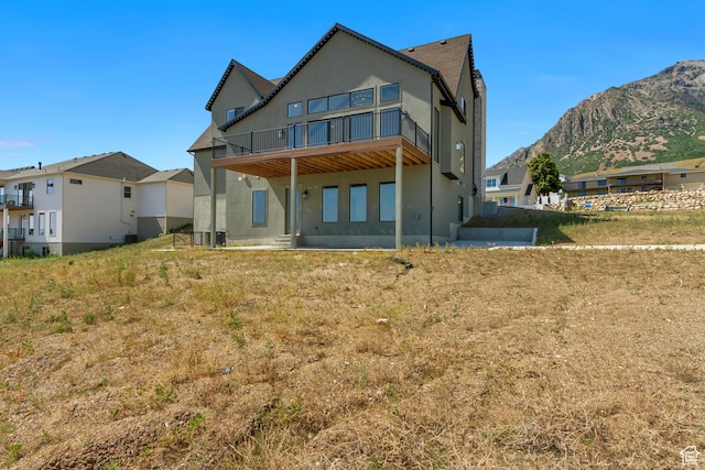 481 E 3675 N, North Ogden, UT 84414 - back of house with a mountain view, stucco siding, and a balcony