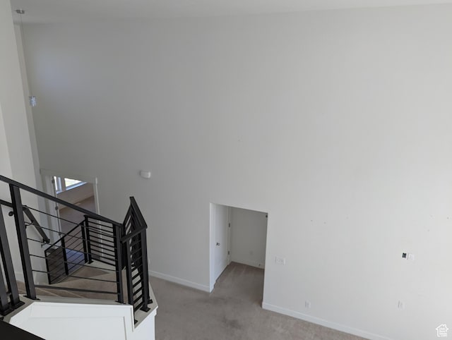 57 N Midland Dr, Saratoga Springs, UT 84045 - staircase featuring carpet flooring and a high ceiling