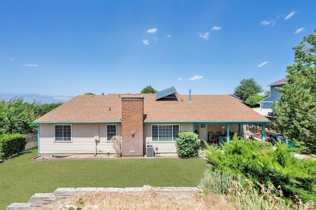11901 S Maple Ridge Rd, Sandy, UT 84094 - rear view of house with a chimney and roof with shingles