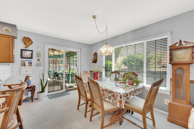 11901 S Maple Ridge Rd, Sandy, UT 84094 - dining space with light carpet and a chandelier