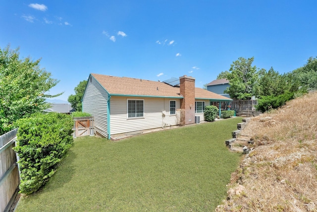 11901 S Maple Ridge Rd, Sandy, UT 84094 - rear view of property with a fenced backyard and a chimney