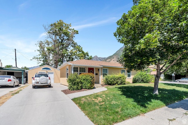 657 N 1100 E, Provo, UT 84606 - single story home with driveway, stucco siding, a front lawn, and a mountain view