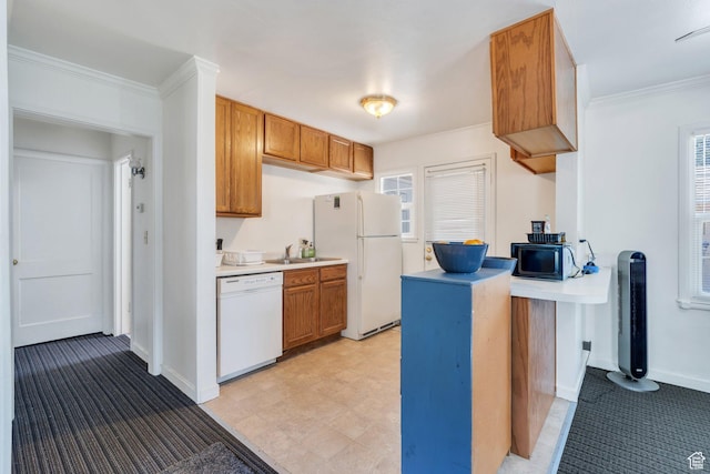 657 N 1100 E, Provo, UT 84606 - kitchen featuring white appliances, light countertops, brown cabinets, light carpet, and ornamental molding