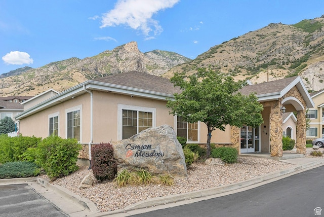 1676 E 1080 S, Provo, UT 84604 - view of front of house with stone siding, a mountain view, and stucco siding