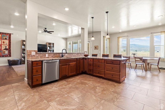 1145 W 500 N, Manti, UT 84642 - kitchen featuring stainless steel dishwasher, backsplash, brown cabinets, healthy amount of natural light, and recessed lighting