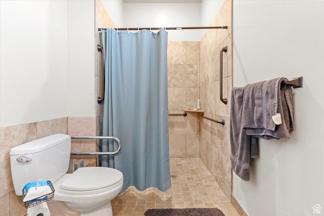 1145 W 500 N, Manti, UT 84642 - bathroom with a tile shower, tile walls, and wainscoting