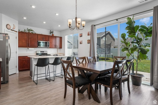 969 S 875 W, Springville, UT 84663 - dining room featuring recessed lighting, light wood-style floors, and a chandelier