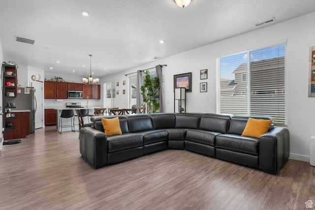 969 S 875 W, Springville, UT 84663 - living area with light wood-style flooring, a chandelier, and recessed lighting