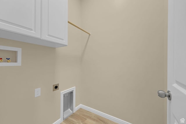 454 E 850 S Unit 106, Brigham City, UT 84302 - washroom with electric dryer hookup, light wood-style flooring, cabinet space, and washer hookup