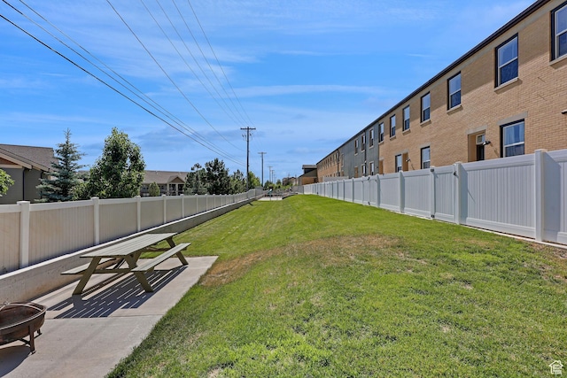 454 E 850 S Unit 106, Brigham City, UT 84302 - fenced backyard featuring a patio and an outdoor fire pit