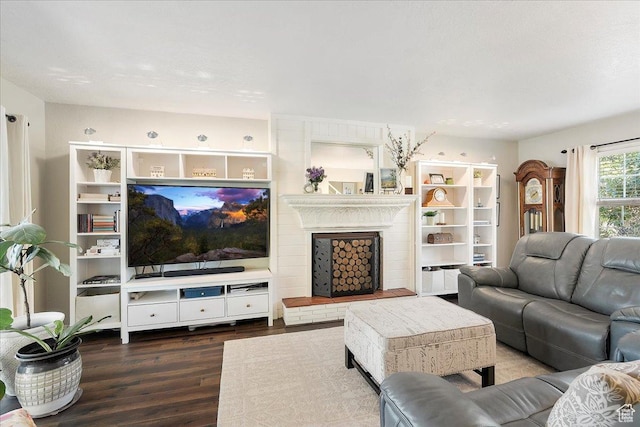 5203 Chambers St, South Ogden, UT 84403 - living area featuring wood finished floors and a brick fireplace