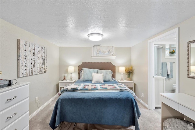 5203 Chambers St, South Ogden, UT 84403 - bedroom with light colored carpet, a textured ceiling, and connected bathroom