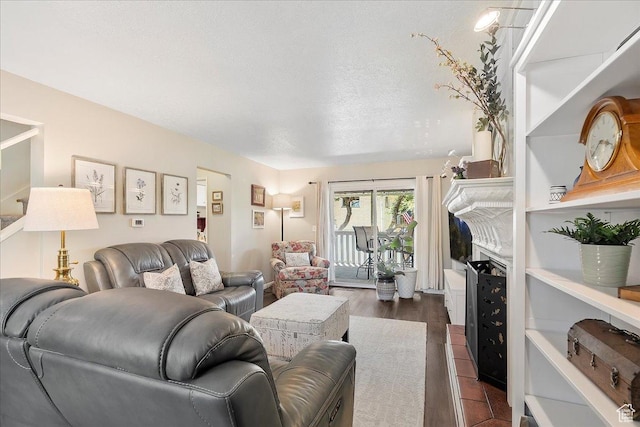 5203 Chambers St, South Ogden, UT 84403 - living area featuring dark wood-style floors and a textured ceiling