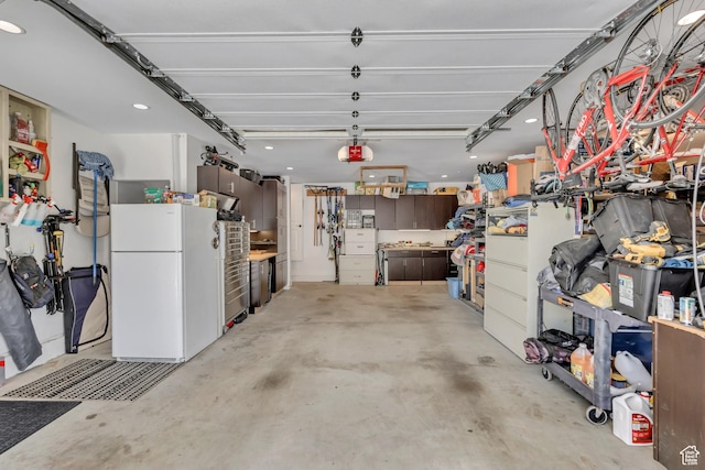 2040 E Lambourne Ave, Millcreek, UT 84109 - garage with freestanding refrigerator, a garage door opener, and recessed lighting