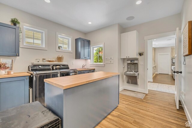 2040 E Lambourne Ave, Millcreek, UT 84109 - kitchen with wood counters, independent washer and dryer, light wood-style floors, recessed lighting, and gray cabinets