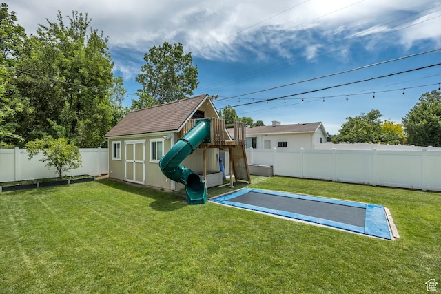2040 E Lambourne Ave, Millcreek, UT 84109 - back of house with a playground, a fenced backyard, and a storage unit