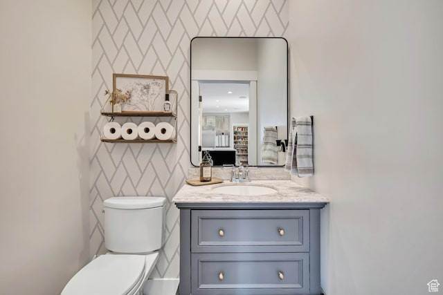 2040 E Lambourne Ave, Millcreek, UT 84109 - half bathroom with vanity and wallpapered walls