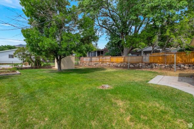1540 23rd St, Ogden, UT 84401 - fenced backyard featuring a storage unit