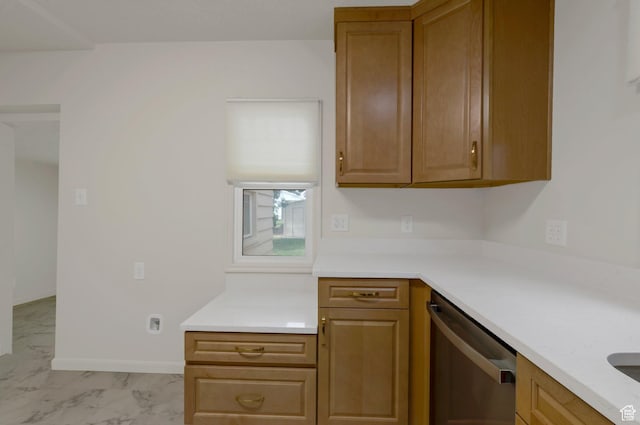 1540 23rd St, Ogden, UT 84401 - kitchen featuring stainless steel dishwasher, light marble finish flooring, light countertops, and brown cabinetry