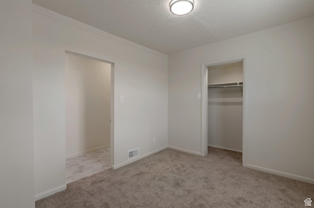 1540 23rd St, Ogden, UT 84401 - unfurnished bedroom with ornamental molding, carpet flooring, a textured ceiling, and a closet