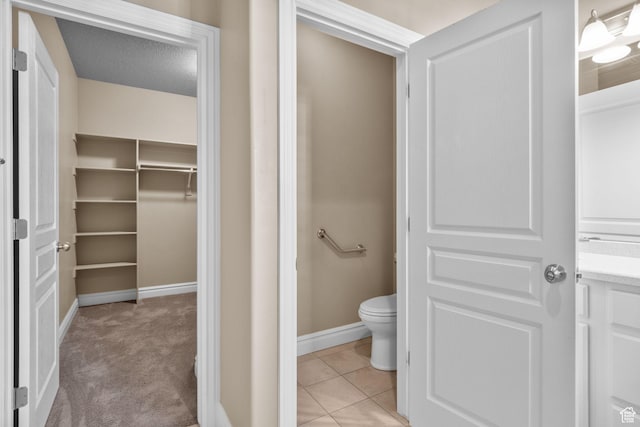 4892 W Veeroma Way S, Jordan, UT 84009 - bathroom with a walk in closet and tile patterned flooring