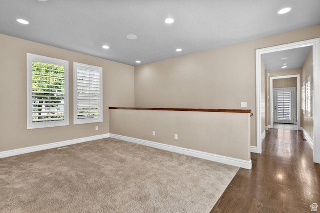 4892 W Veeroma Way S, Jordan, UT 84009 - empty room with recessed lighting and dark wood-style floors