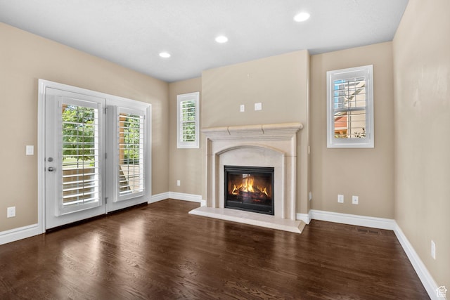4892 W Veeroma Way S, Jordan, UT 84009 - unfurnished living room featuring wood finished floors, a high end fireplace, plenty of natural light, and recessed lighting