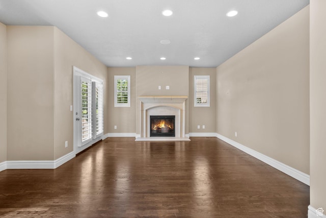 4892 W Veeroma Way S, Jordan, UT 84009 - unfurnished living room with wood finished floors, recessed lighting, and a fireplace