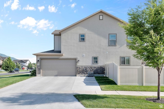 231 N 750 W, Springville, UT 84663 - view of home's exterior with stucco siding, a garage, driveway, and stone siding