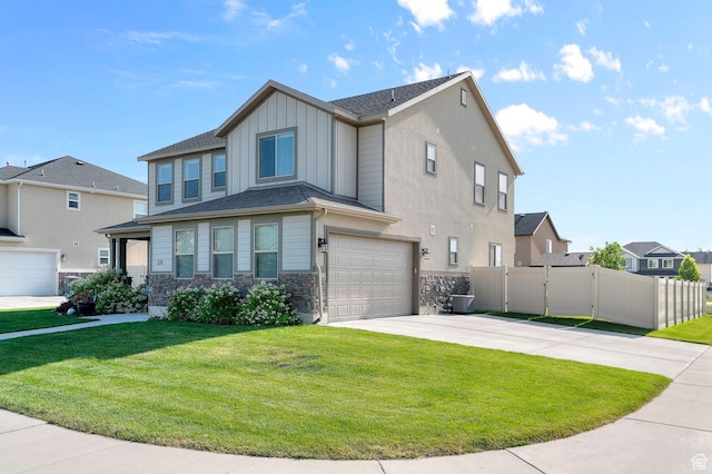 231 N 750 W, Springville, UT 84663 - view of front facade featuring board and batten siding, concrete driveway, a garage, stone siding, and a residential view