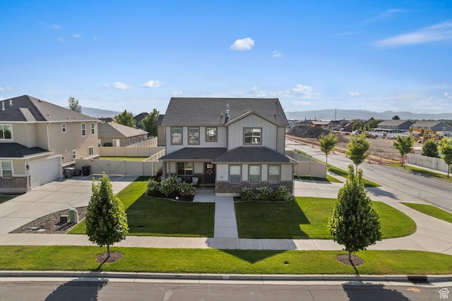 231 N 750 W, Springville, UT 84663 - view of front facade featuring driveway, a residential view, an attached garage, board and batten siding, and a mountain view