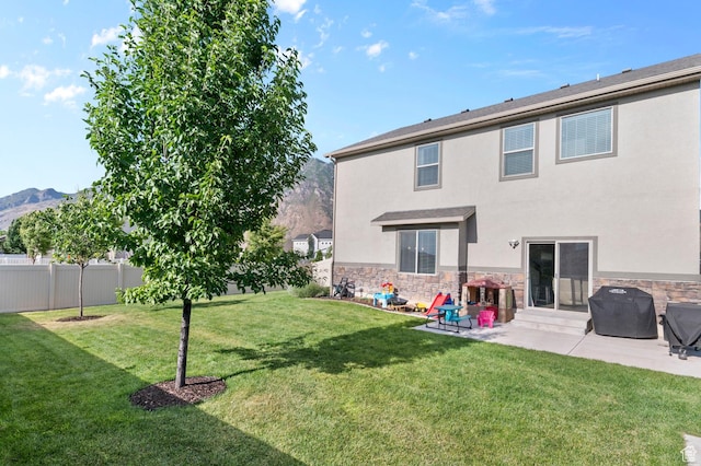 231 N 750 W, Springville, UT 84663 - rear view of house featuring stone siding, stucco siding, a patio area, and a mountain view