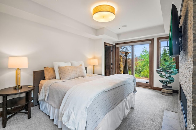 4121 Fairway Ln Unit A1, Park City, UT 84098 - bedroom with a tray ceiling, light carpet, and access to outside