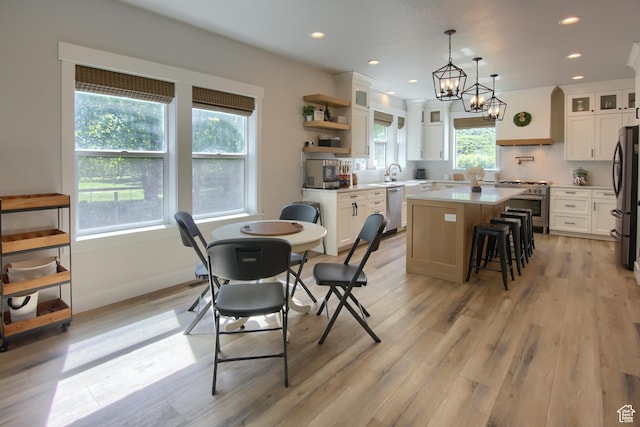 6038 N Hidden Valley Rd Unit 319, Mountain Green, UT 84050 - dining space featuring light wood finished floors, recessed lighting, and a chandelier