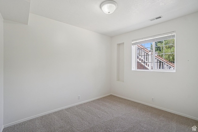 4964 Boulder Glen Cir, West Jordan, UT 84088 - carpeted spare room featuring baseboards and a textured ceiling